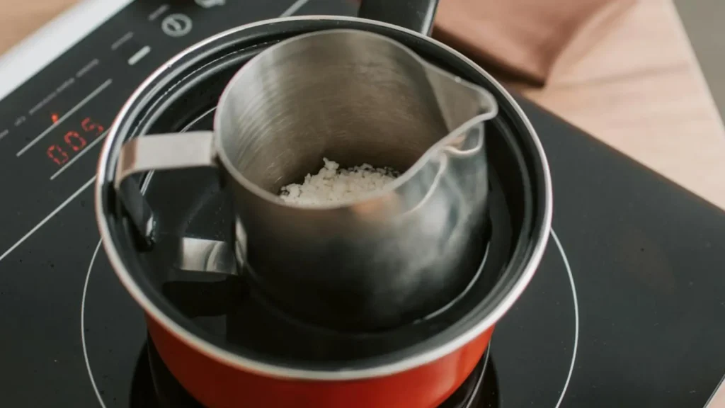 Melting the Soy Wax, Mango Butter and CBD oil in a double boiler