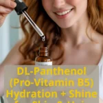 Woman applying skincare product with dropper.