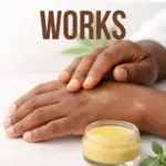 A man rubbing a balm into his hands.