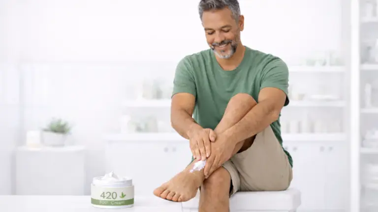 A man applying cannabis foot cream to his foot.