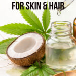 A fresh coconut cracked open with a bottle of glycerin and some cannabis leaves.